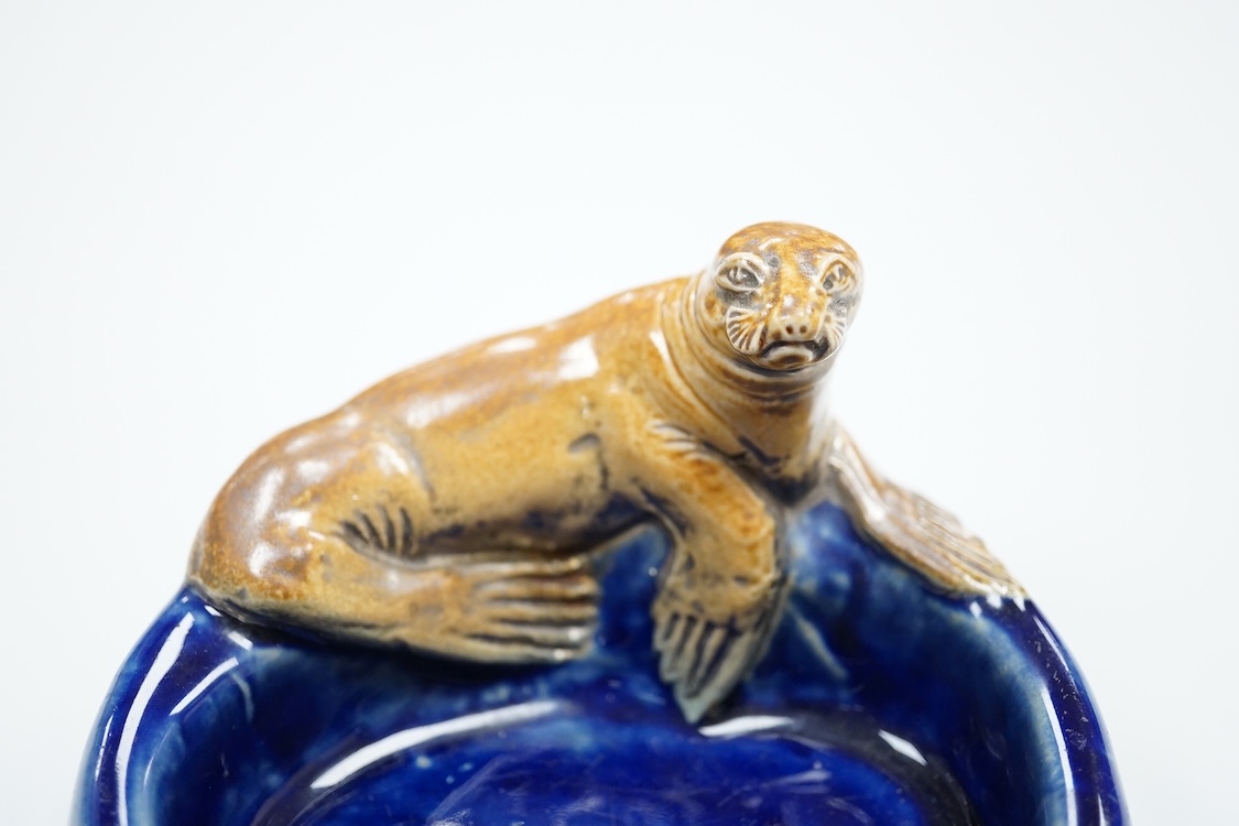 A Doulton ‘silver seal port’ advertising ashtray, 13cm wide (a.f)